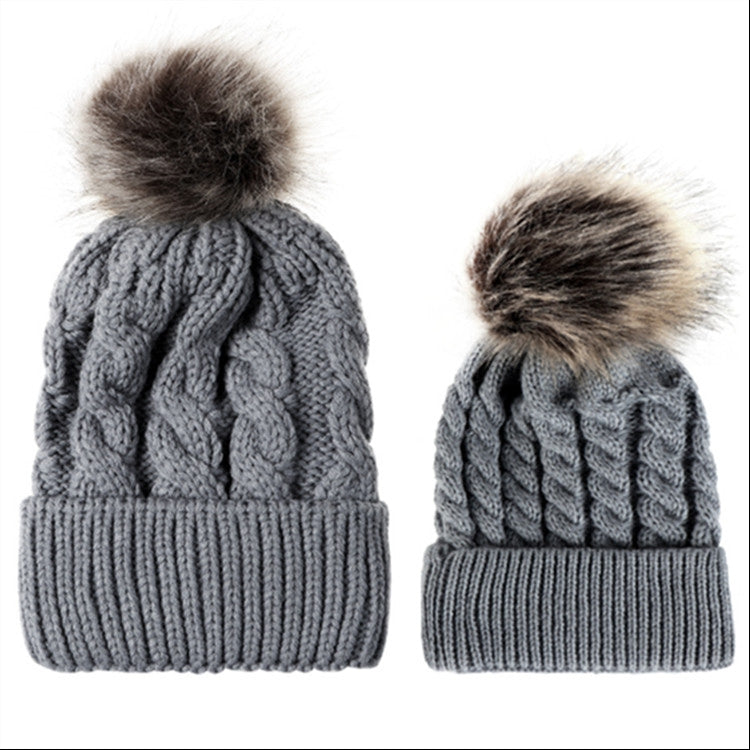 Parent-child knit beanie set in gray with brown faux-fur pom pom tops