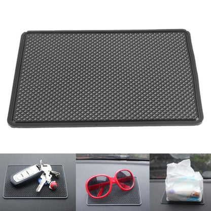 Black textured anti-slip car dashboard mat, rectangular with raised border edges