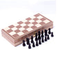 Wooden folding chessboard closed with chess pieces stored in the compartments