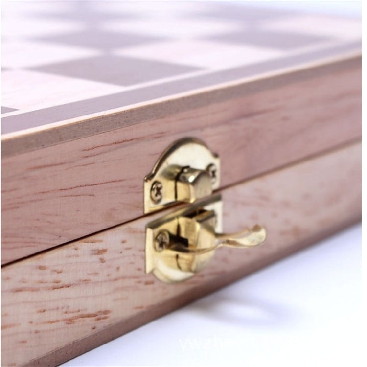 Brass latch on wooden folding chessboard edge