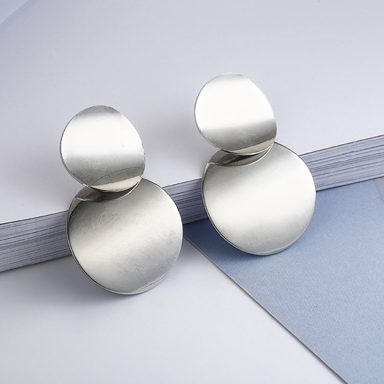 Silver-tone round drop earrings with three curved discs, shown from the side.