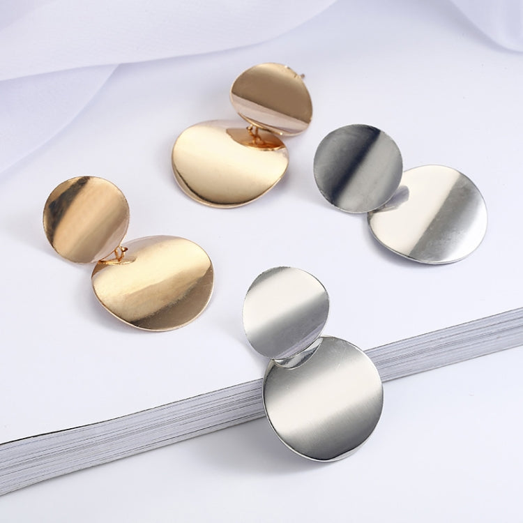 Gold- and silver-tone round drop earrings, each with three smooth discs.