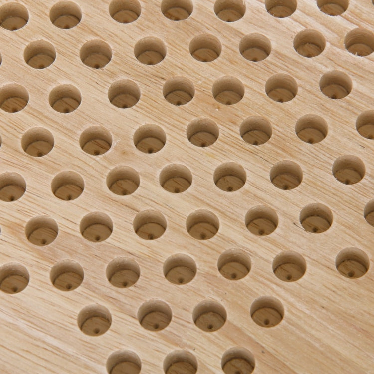 Hexagon wooden board with many circular peg holes for placing checkers pieces