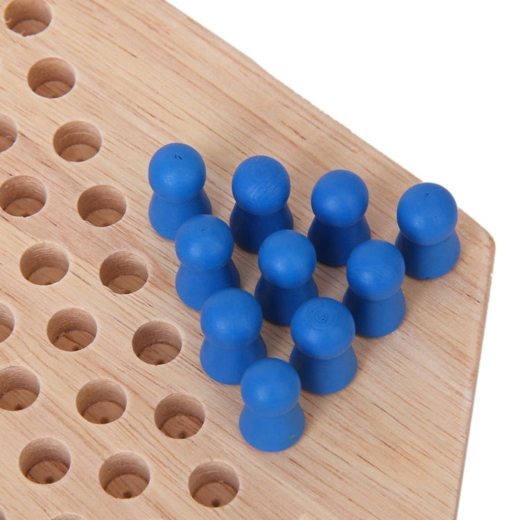 Blue checker pegs on a hexagon wooden board with circular holes