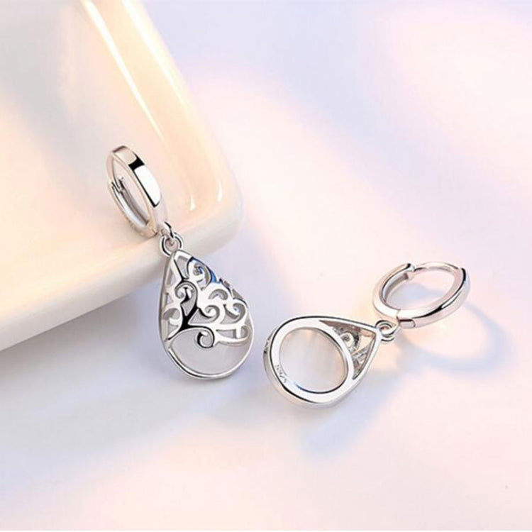 Sterling silver hoop drop earrings with teardrop pendant, pink and white opal-style center.