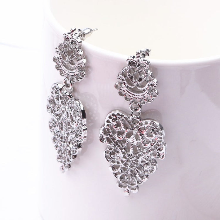 Silver-toned dangling filigree heart-and-flower pendant earrings, layered