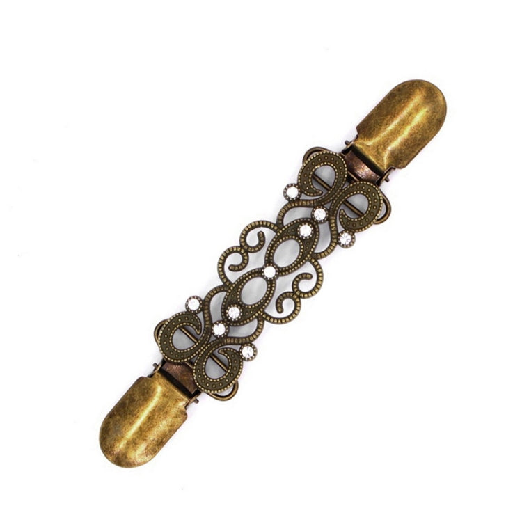 Antique bronze cardigan shawl clip with ornate filigree links and rhinestone accents