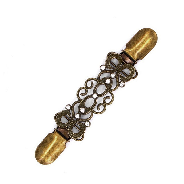 Antique bronze decorative sweater shawl clip with cutout filigree and rhinestones