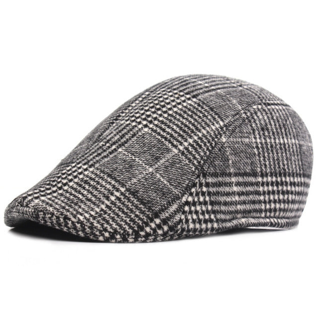 Gray flat cap with lattice and windowpane check pattern, curved crown
