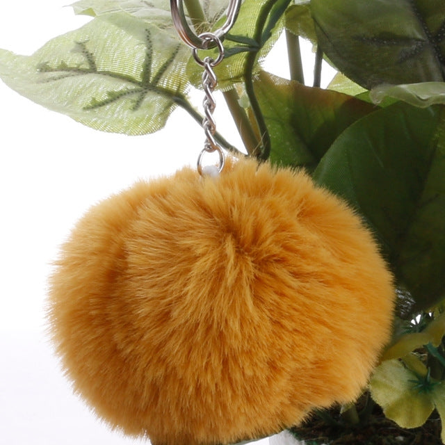 Orange faux rabbit fur pompon keychain with silver chain and key ring