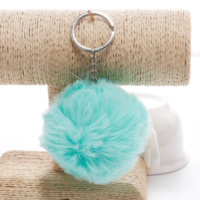Light teal faux rabbit fur pompon keychain with silver metal key ring and chain