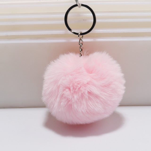 Pink faux rabbit fur pompon keychain with silver key ring and chain