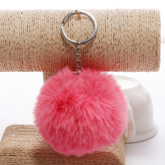Pink faux rabbit fur pompon keychain with silver key ring and metal chain