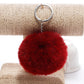 Red faux rabbit fur pompon keychain with silver metal ring and clasp