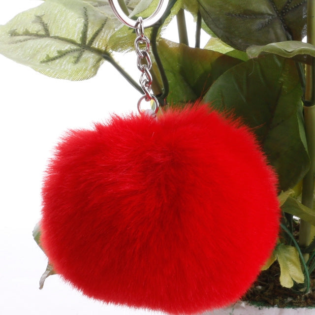 Bright red faux rabbit fur pompon keychain with silver key ring and chain