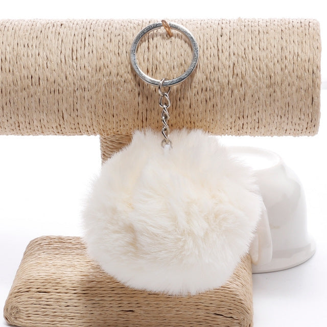 Cream faux fur pompon keychain with metal key ring and dangling chain