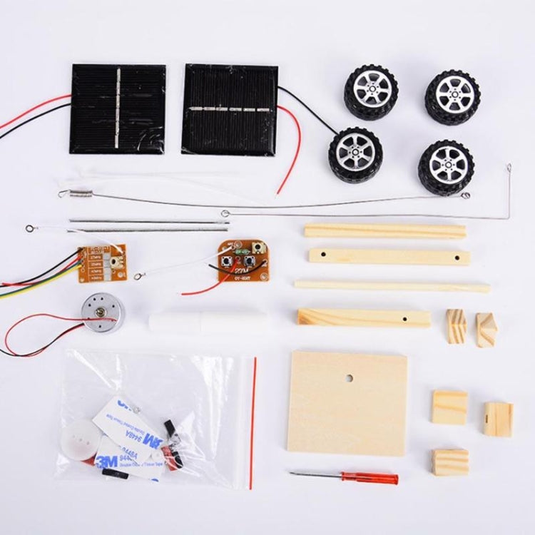 Mini wooden remote control car parts set with solar panels, wheels, and wood pieces