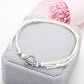 White wax string anklet with sea turtle charm and small round bead accents