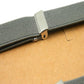 Gray shoulder strap clip with metal adjuster and snap fastener for bib pants