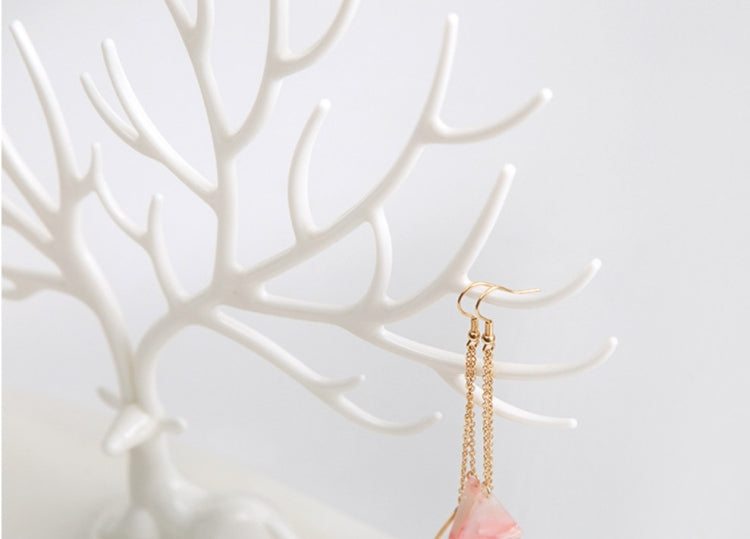White antler jewelry organizer close-up showing hanging earring hook and chain
