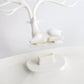White antler jewelry organizer base with seated animal figure and central stand