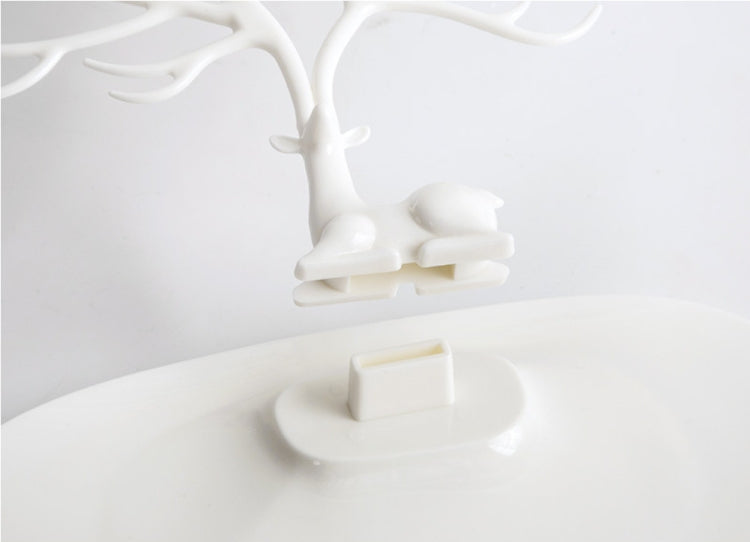 White antler jewelry organizer base with seated animal figure and central stand