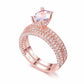 Double-row cubic zirconia ring set in rose tone with oval pink center stone