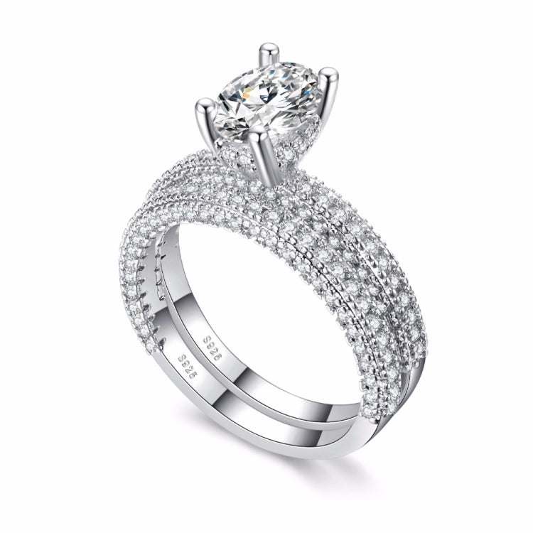 Double-row cubic zirconia ring set in silver tone with round crystal center