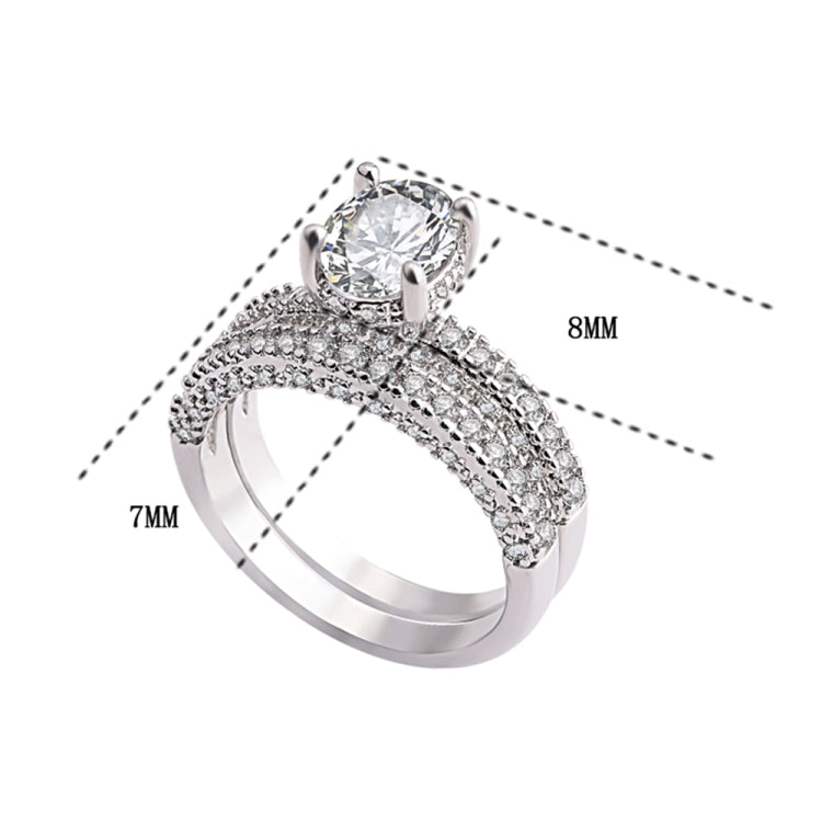 Double-row cubic zirconia wedding ring with round center stone in white gold tone