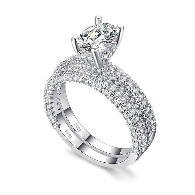 Double-row cubic zirconia engagement ring with round center stone in silver tone