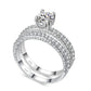 Double-row cubic zirconia wedding ring with round center stone