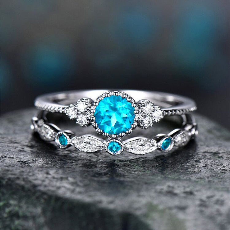 Two-piece silver-tone zircon ring set with round turquoise center and side gems