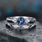 Two-piece silver-tone zircon ring set with round blue center and marquise side accents