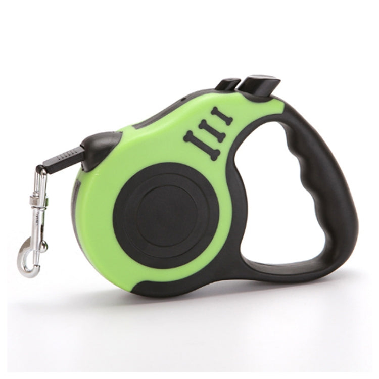 Retractable dog leash with green circular retraction housing and black grip, snap hook