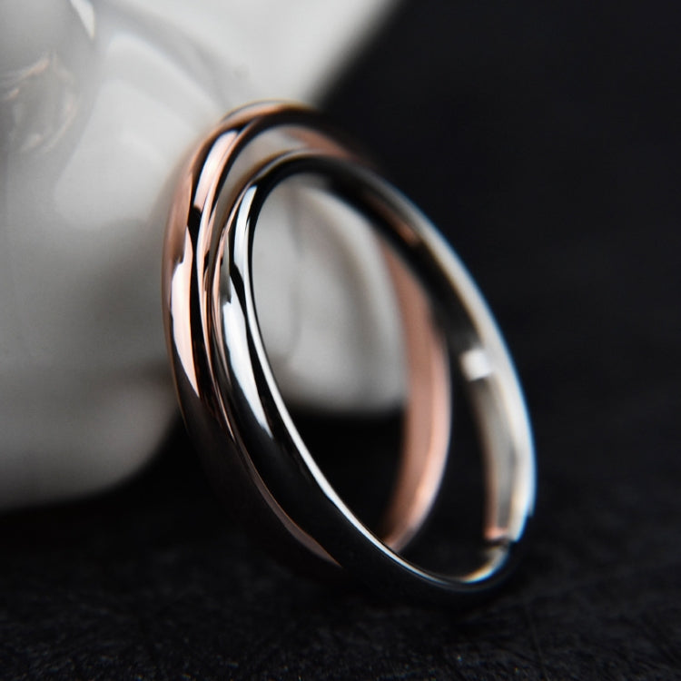 Glossy tri-tone stainless steel ring with black outer edge and silver interior