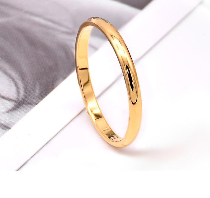 Polished gold stainless steel ring with smooth rounded band