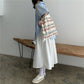 White high-waist A-line midi skirt with a full, loose flare