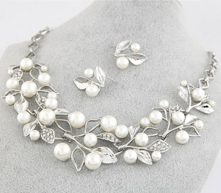 Silver faux-pearl leaf necklace with crystal accents and matching leaf stud earrings