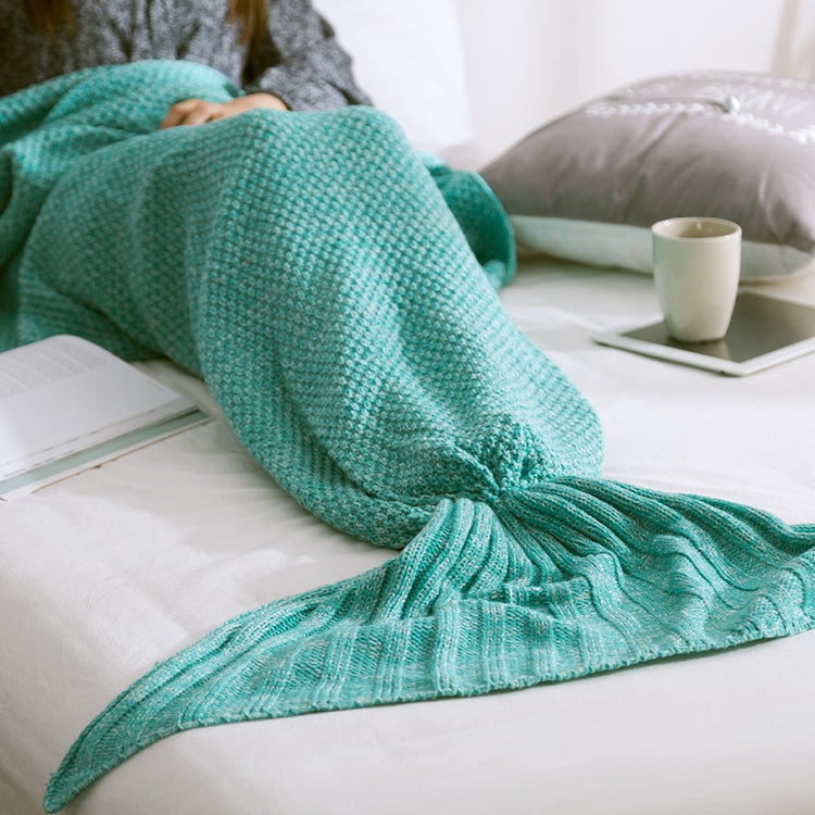 Mermaid tail blanket in teal knit with ruffled fin end
