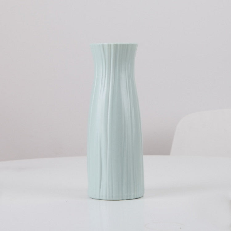 Light blue ribbed plastic vase, tall desktop flower holder