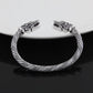 Men's braided cuff bracelet with wolf-head ends, antique silver plated