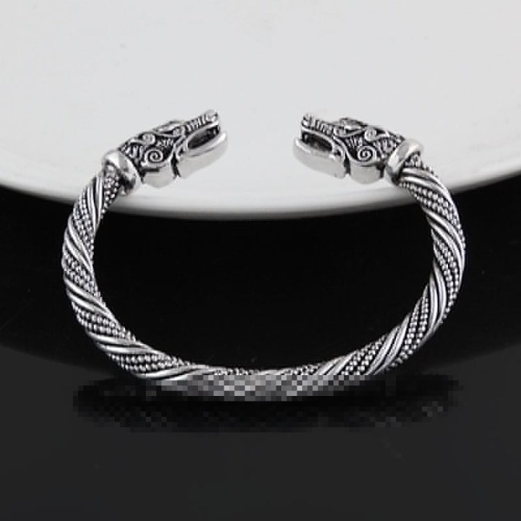 Men's braided cuff bracelet with wolf-head ends, antique silver plated