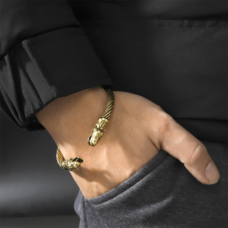 Wolf-head cuff bracelet worn on wrist, antique gold plated, braided style