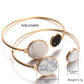 Gold-tone round cuff bangles with white and black faux marble discs