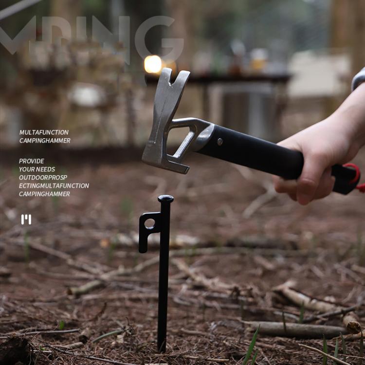 Black camping hammer with claw head and stake-puller accessory, red lanyard