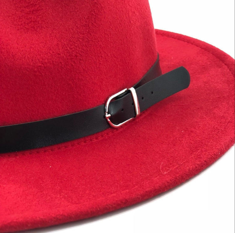 Red felt fedora hat close-up showing black band and metal buckle