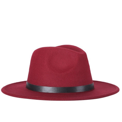 Wine red fedora hat with wide black band and metal buckle detail