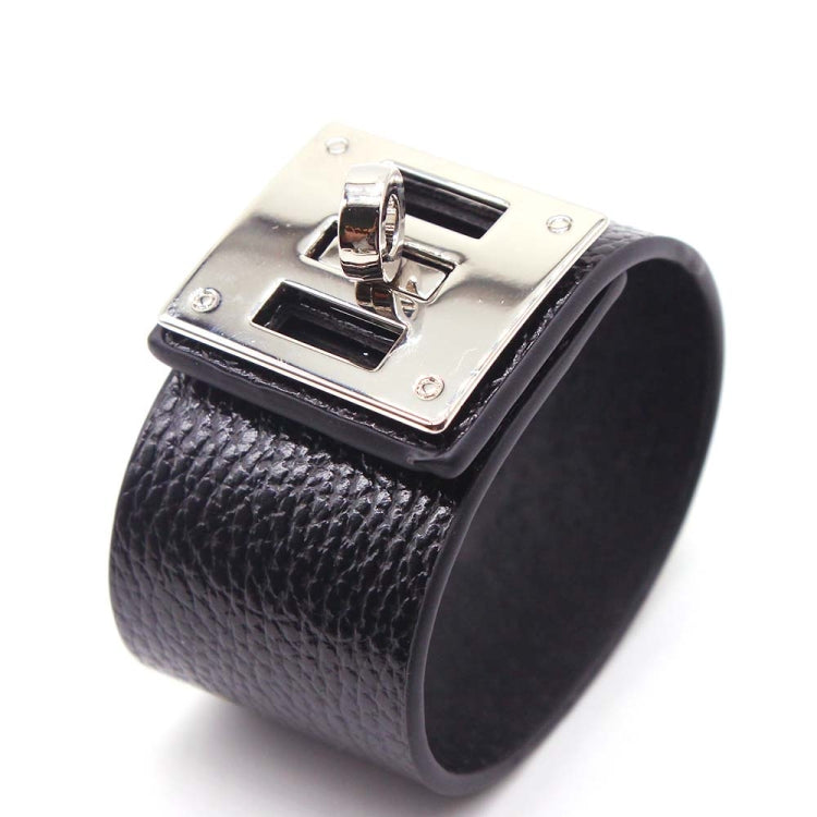 Wide black leather cuff bracelet with silver-tone square logo plate and metal clasp