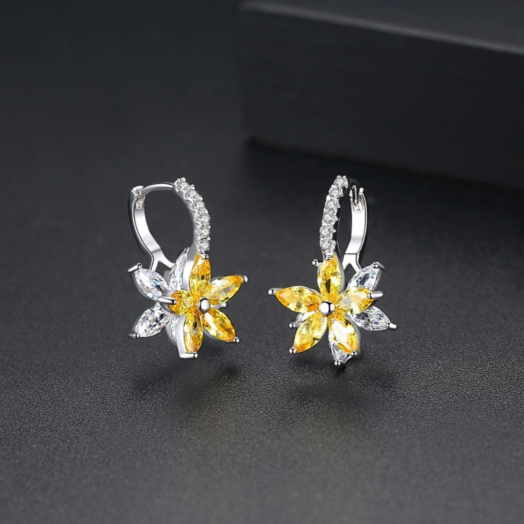 Yellow and clear flower-shaped cubic zirconia stud earrings with silver-tone backs