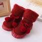 Red baby winter floor socks with pom-pom ties and fuzzy high cuffs